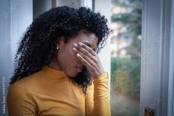 Obraz One black woman depressed in front of window
