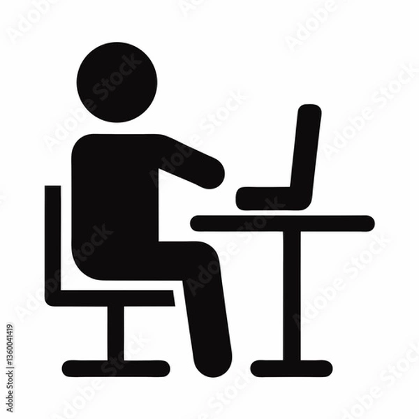 Fototapeta A businessman working on a laptop in an office setting