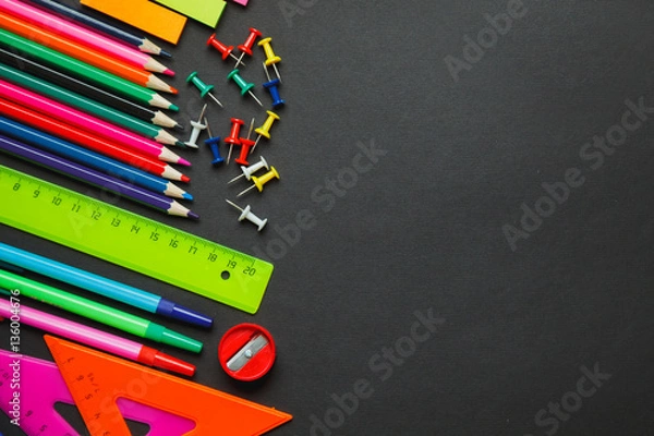 Obraz School supplies border on a chalkboard background