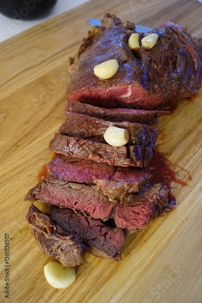 Obraz Close up of a juice beef steak being cooked 