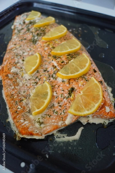 Obraz Close up of a grilled whole salmon filet with lemon
