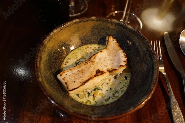 Obraz Close up of fancy decorated plates with delicious looking food at a fine dining restaurant in Sweden