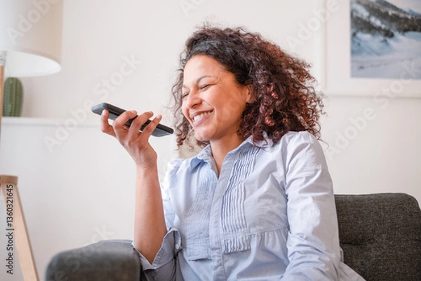 Obraz Happy black woman making a phone call using voice notes