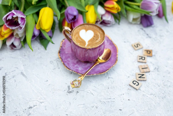 Fototapeta Beautiful spring background. Cup with coffee with tulips. Tulips background.