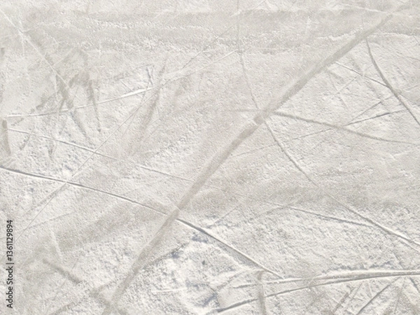 Fototapeta Ice background with marks from skating and hockey. Ice hockey rink scratches surface