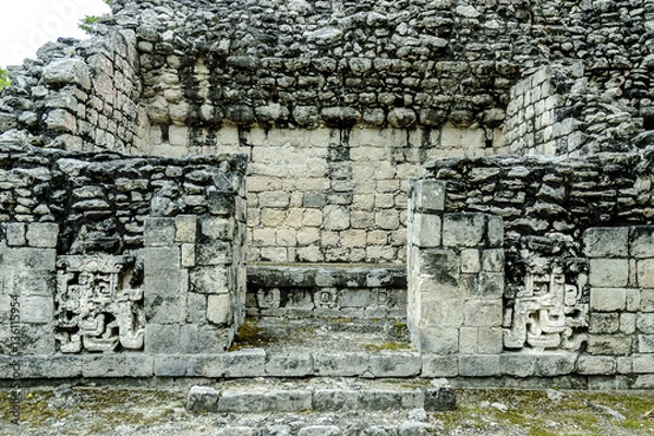 Fototapeta temple in ruins with reliefs in the Mayan archaeological Chicanna enclosure in the reservation of the biosphere of Calakmul, Campeche, Mexico