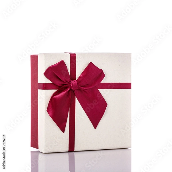 Fototapeta New color gift box with ribbon. Studio shot isolated on white