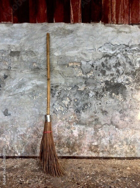 Obraz broom on the concrete wall
