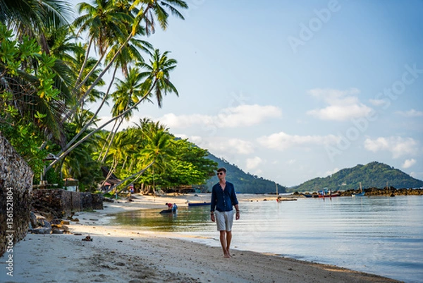 Obraz męzczyzna na egzotycznej plaży