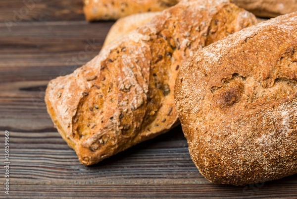 Obraz Homemade natural breads. Different kinds of fresh bread as background, perspective view with copy space