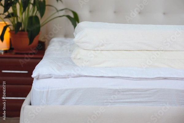 Fototapeta Two orthopedic pillows on the mattress. Concept of healthy sleep.