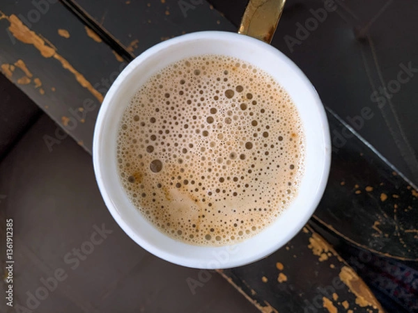 Obraz hot coffee latte with foam in a mug