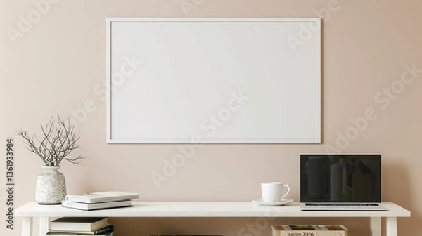 Fototapeta A white rectangular frame displayed above a side table in a living room with a cup, laptop, and books stacked nearby. HD 8K mockup wallpaper Photographic Image