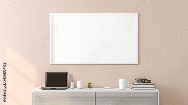 Fototapeta A white rectangular frame hanging above a hallway console with a cup, a laptop, and a few books. HD 8K mockup wallpaper Photographic Image