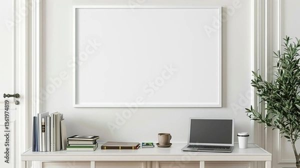 Fototapeta A white rectangular frame hanging in a hallway above a console table with a cup, a laptop, and a few books.  HD 8K mockup wallpaper Photographic Image