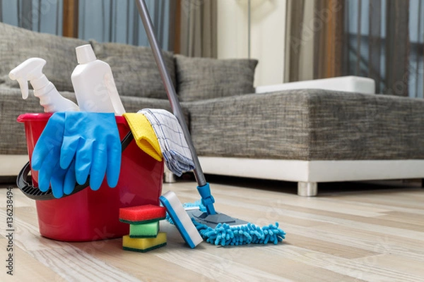 Fototapeta Cleaning service. Bucket with sponges, chemicals bottles and mopping stick. Rubber gloves and towel. Household equipment.