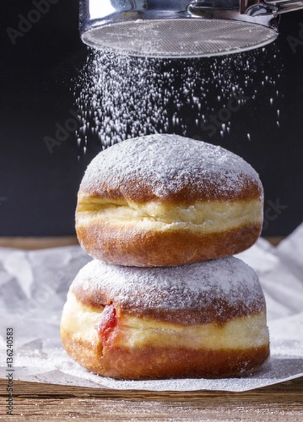 Obraz Fresh donuts with strawberry jam, sprinkled with powdered sugar