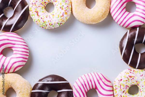 Obraz Colorful donuts composition on a white background