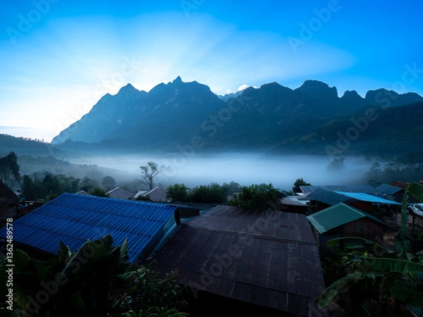 Fototapeta First Light Silhouette: Hill Tribe Village and Doi Luang Range