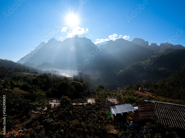 Fototapeta Faithful Light: Doi Luang Chiang Dao in Misty Embrace