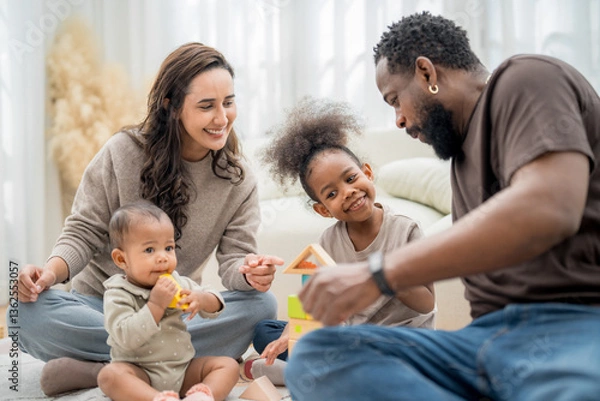 Fototapeta Family enjoys a fun day playing with building blocks at home with children in a cozy living room filled with natural light