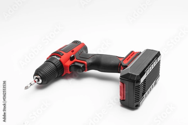 Fototapeta a cordless screwdriver on a white background. isolate