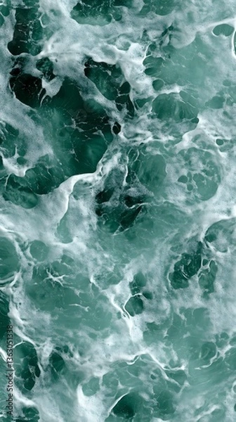 Fototapeta A mesmerising dance between emerald sea and foamy white waves above view