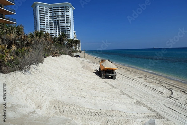 Obraz Beach erosion along the Atlantic Ocean requires a sand replenishment project to protect the remaining sand dune.