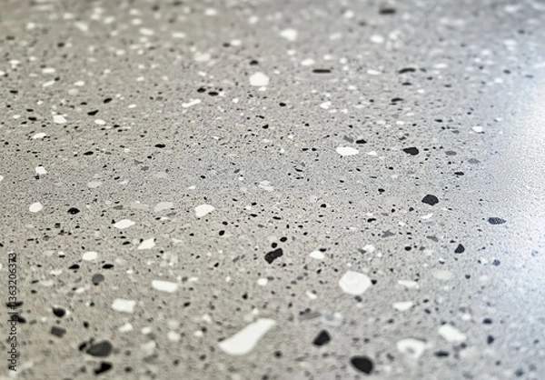 Fototapeta A gray surface with scattered black and white specks, fine texture, modern abstract style, minimalist composition, even distribution, visual contrast, contemporary design.