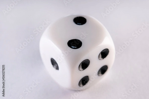 Obraz Single dice on a white table