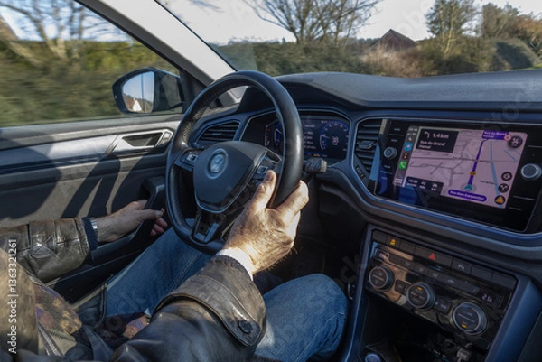 Fototapeta Driving on a country road with navigation system March 15 2025 Normandie