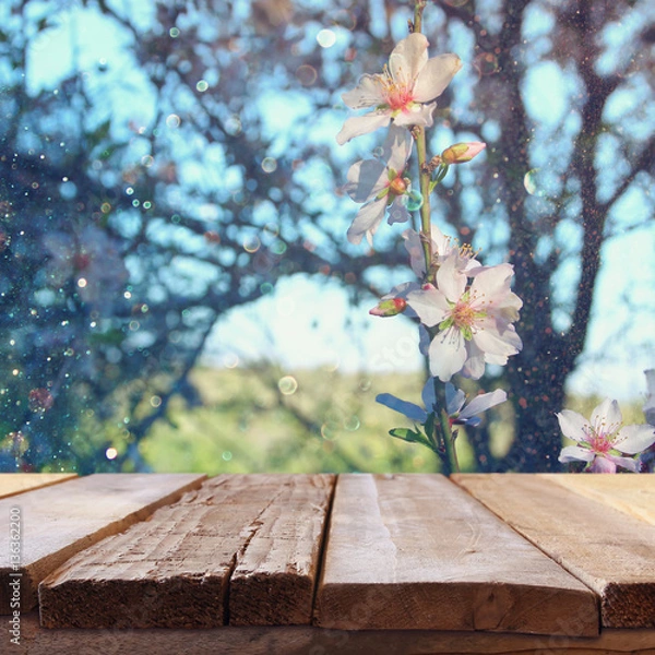 Fototapeta wooden rustic table in front of spring cherry tree