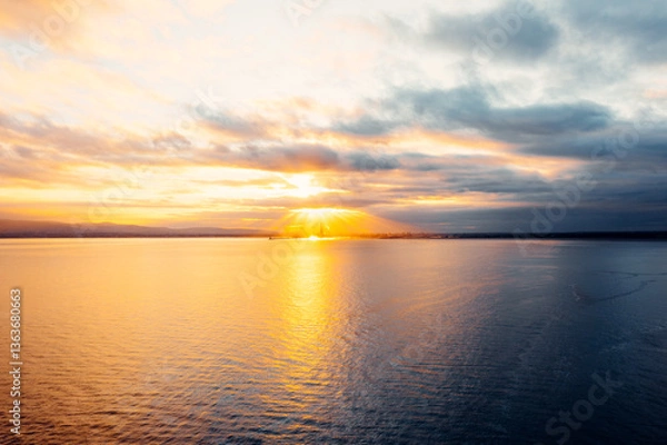 Obraz Golden Hour Majesty: Aerial Sunset Over Poolbeg Towers and Lighthouse, Dublin Skyline Aglow with Sun Rays and Coastal Charm