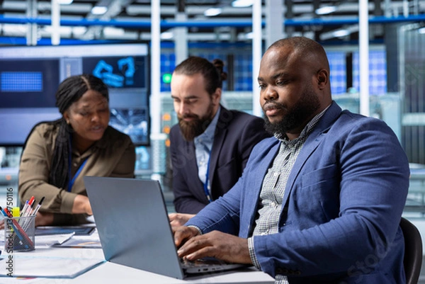 Fototapeta Manufacturing plant executives meeting with shareholders to review operational data on laptop. Investors look at metrics on notebook, exploring potential investment strategies for business expansion