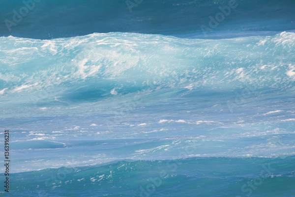 Fototapeta Shades of blue in a wave about to break on a maui shore.