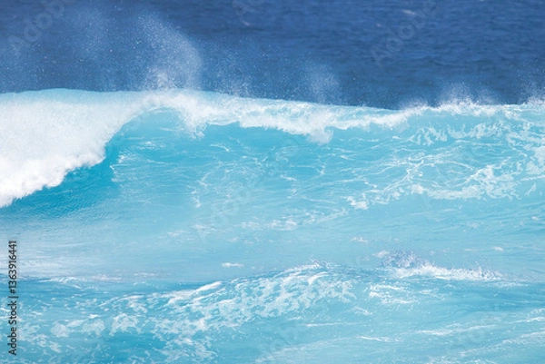 Fototapeta Shades of blue in a wave about to break on a maui shore.
