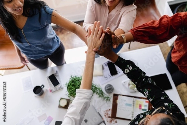 Fototapeta Diverse group of women joining hands in teamwork. Teamwork, collaboration, and unity are highlighted. Diverse hands come together as teamwork and business collaboration. Business team building