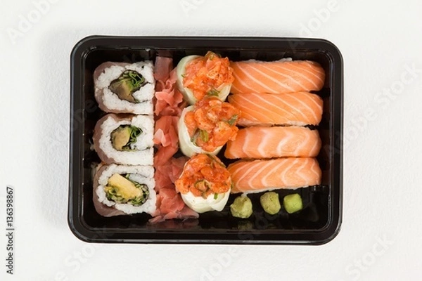 Fototapeta Set of assorted sushi kept in a black box