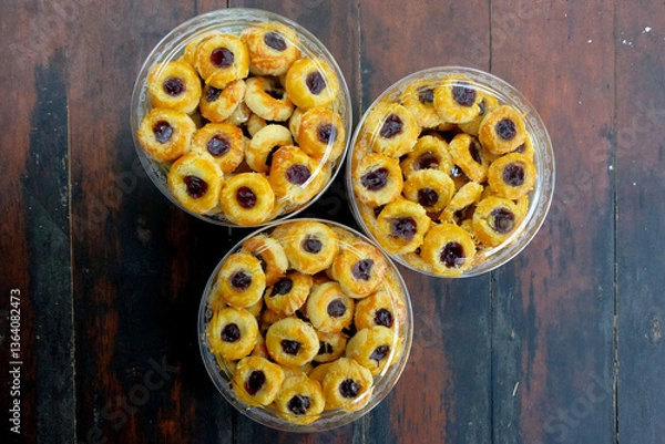 Obraz thumbprint cookies with blueberry jam in jar
