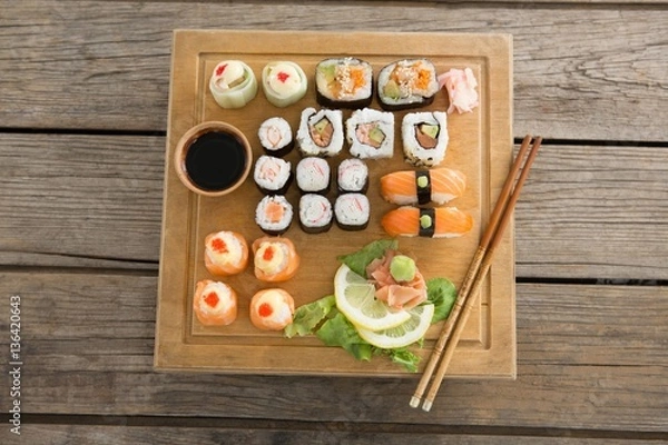 Obraz Set of assorted sushi served on wooden tray