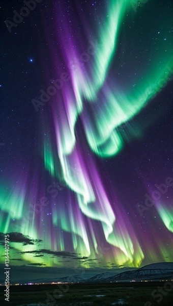 Obraz In the mesmerizing scene, swirling ribbons of vibrant green and purple Northern Lights dance across a vast cosmic expanse, framed by a backdrop of twinkling stars and distant galaxies. 
