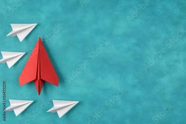 Fototapeta Leading Red Paper Plane on Textured Turquoise Background Highlighting Direction and Strategy