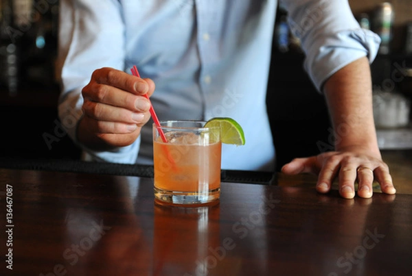 Obraz Bartender serving a cocktail