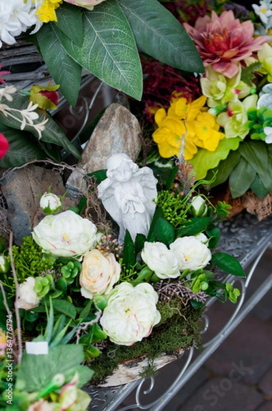 Fototapeta Colorful artificial flower arrangement with realistic details

