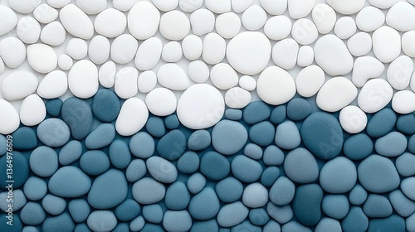Fototapeta A collection of smooth stones in shades of blue, white, and beige is arranged neatly on a light background. 