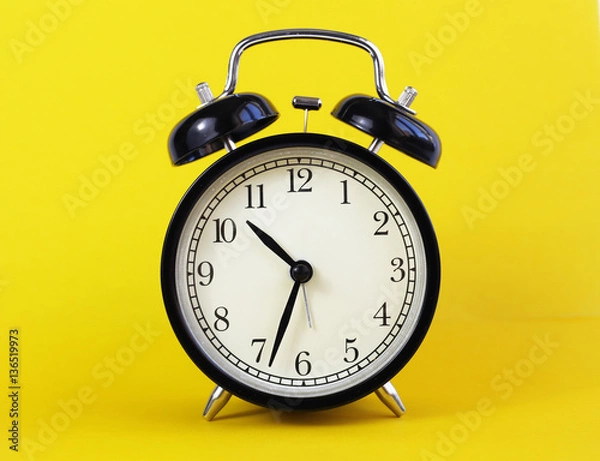 Obraz classic table clock on a yellow background. interior Features
