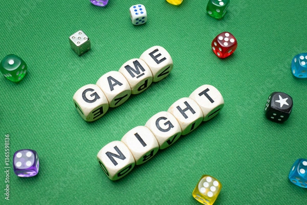 Obraz Word dice showing the phrase 'Game Night', with a selection of colourful dice around it on a vibrant green baize fabric..