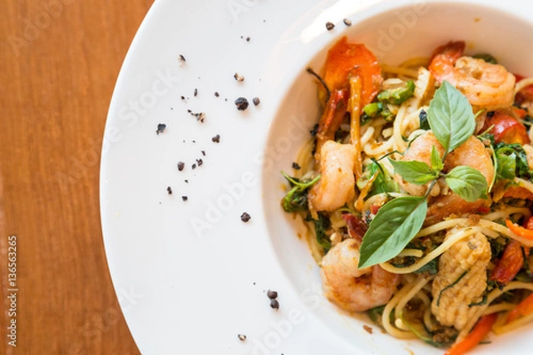 Obraz spaghetti seafood mix with basil and herb