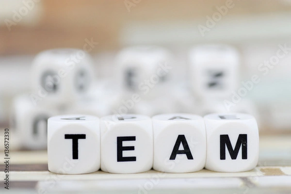 Fototapeta team write in dice letters