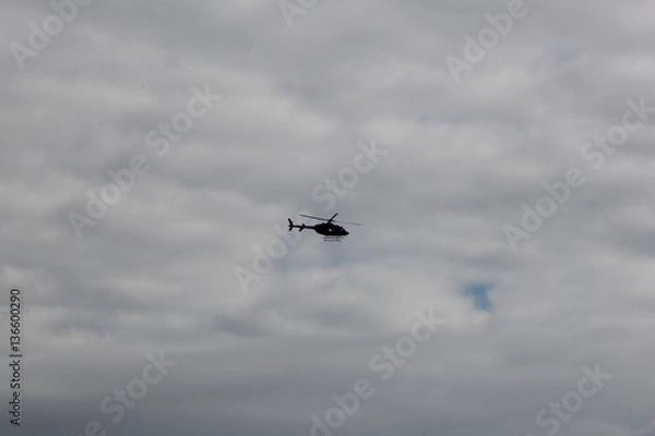 Fototapeta The helicopter in the sky